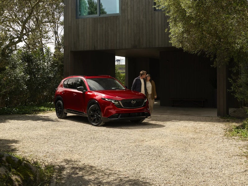 A 2026 Mazda CX-5 in red, highlighting its compact SUV style and modern features.