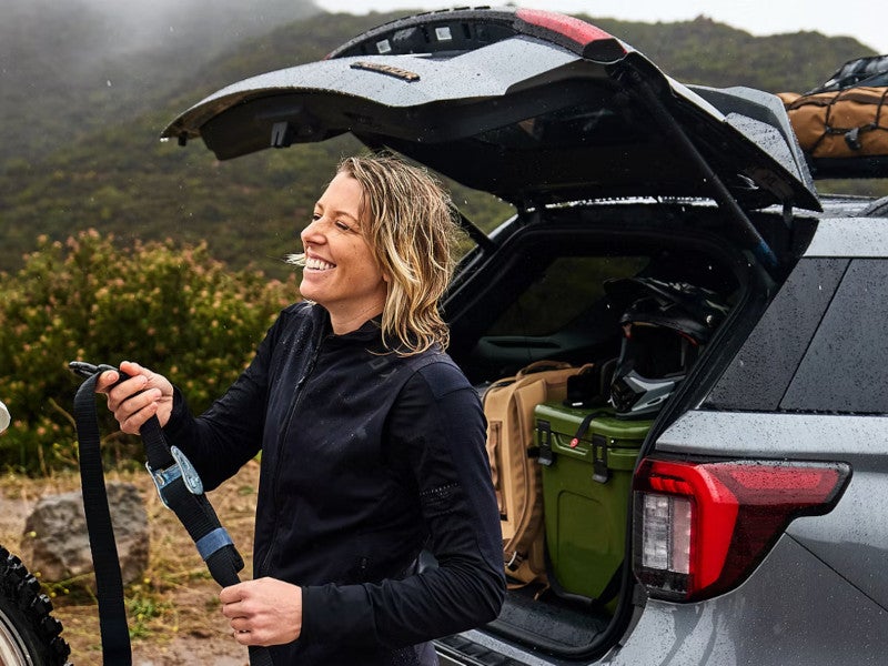 Lady unloading the Ford SUV